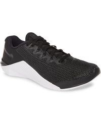 nike metcon 5 gold black