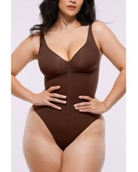 Shapellx - Skin Flow Zipper Front Thong Bodysuit - Lyst