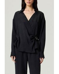 Nocturne - Logo Buckle Wrap Blouse - Lyst
