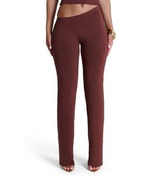 Naked Wardrobe - Asymmetric Bootcut Pants - Lyst