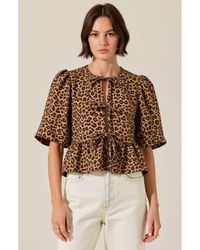 Modenaire - Peplum Top With Front Tie Closures And Short Puff Sleeves - Lyst