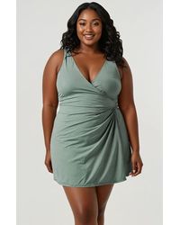 Calypsa - Plus Size Alana Wrap-Style Swim Dress With Hidden Bottoms And Adjustable Straps - Lyst