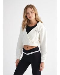 Revyve Active - Cropped V-Neck Hoodie - Lyst