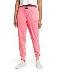 nike women's sportswear tracksuit joggers rust pink