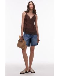 TOPSHOP - Loose Fit Raw Hem Cutoff Denim Shorts - Lyst