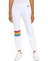 white sweatpants with rainbow stripe