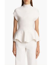 KHAITE - Andra Mock Neck Peplum Knit Top - Lyst