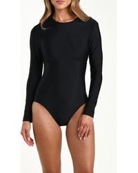 L'Agence - Lambert Solids Long Sleeve One-Piece Rashguard Swimsuit - Lyst