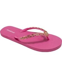 Bebe - Lion Charm Thong Flip Flop - Lyst