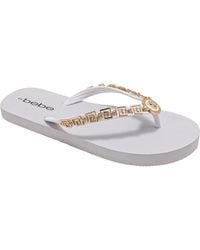 Bebe - Lion Charm Thong Flip Flop - Lyst