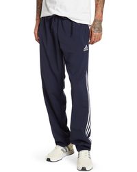 adidas Essentials French Terry Tapered-cuff 3-stripes Pants In Linen Green/green Oxide At
