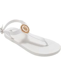 Bebe - Lion Charm T-Strap Sandal - Lyst