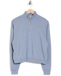 nike femme rally half zip