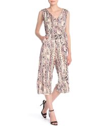white snakeskin jumpsuit