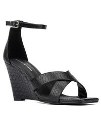 FASHION TO FIGURE - Marcie Snake Embossed Wedge Sandal - Lyst