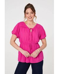 Izabel London - Ruched Short Puff Sleeve Peplum Blouse - Lyst