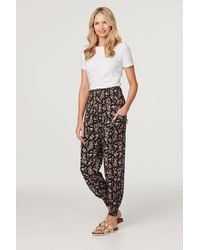 Izabel London - Printed Relaxed Tapered Harem Pants - Lyst