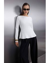 WOVCOR - Boat Neck Peplum Long Sleeve Knit Blouse - Lyst