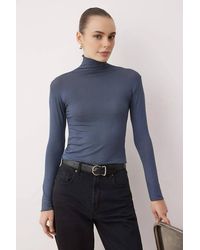 WOVCOR - Sheer Stand Collar Stretch Knit Long Sleeve Blouse - Lyst