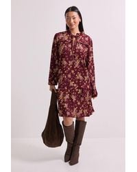 Dorothy Perkins - Petite Floral Tie Neck Tiered Smock Jersey Mini Dress - Lyst