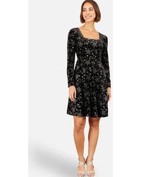 Yumi' - Starburst Foil Print Long Sleeve Skater Dress - Lyst