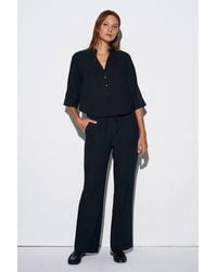 Dilvin - Wide-Leg Crepe Trousers - Lyst