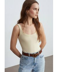 Dilvin - Sleeveless Ribbed Cotton-Blend Bodysuit - Lyst
