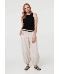 Izabel London - Belted Relaxed Wide Leg Barrel Trousers - Lyst