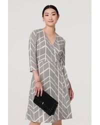 Izabel London - Printed 3/4 Sleeve Knee Length Wrap Dress - Lyst