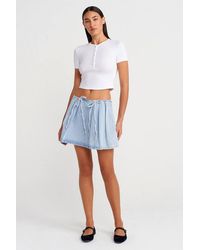 Dilvin - Cotton Denim Mini A-Line Skirt W/ Bow Detail - Lyst