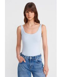 Dilvin - Sleeveless Ribbed Cotton-Blend Bodysuit - Lyst