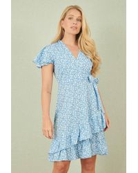 Yumi' - Ditsy Floral Wrap Frill Dress - Lyst