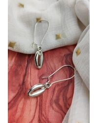The Colourful Aura - Long Cowrie Sea Shell Charm Dangle Earrings - Lyst