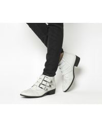 office lucky charm studded boots