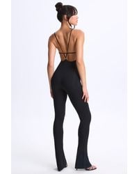 Oh Polly - Modal Plunge Open-Back Flared Jumpsuit - Lyst