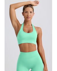 BO+TEE - Define Luxe Halterneck Sports Bra - Lyst