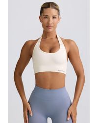 BO+TEE - Define Luxe Halterneck Sports Bra - Lyst