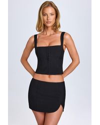 Oh Polly - Curved Low-Rise Mini Skirt - Lyst