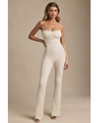 Oh Polly - Bow-Detail Lace Flared Jumpsuit - Lyst
