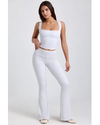 Oh Polly - Ribbed Modal Mid-Rise Foldover Flared Trousers - Lyst