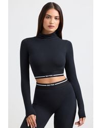 BO+TEE - Backless Turtleneck Long-Sleeve Crop Top - Lyst
