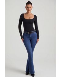 Oh Polly - High-Rise Flared Jeans - Lyst