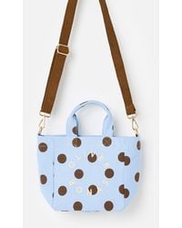 Oliver Bonas - Light & Brown Polka Dot Logo Fabric Mini Tote Crossbody Bag - Lyst