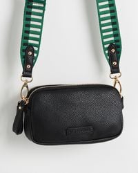 Oliver Bonas - Naha Geometric Green Strap Black Crossbody Bag - Lyst
