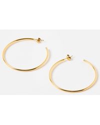 Oliver Bonas - Janis Shiny Tone Waterproof Large Hoop Earrings - Lyst