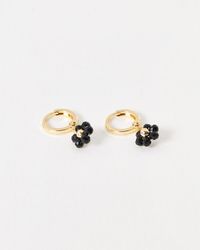 Oliver Bonas - Rosa Black Flower Bead Gold Tone Huggie Earrings - Lyst
