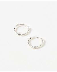 Oliver Bonas - Yara Ball Huggie Earrings - Lyst