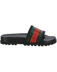 black gucci flip flops