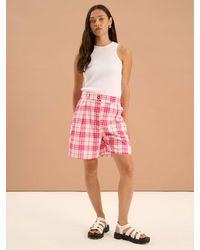 OMNES - Carlina Pleat Front Check Print Shorts - Lyst