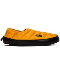 the north face thermoball traction v mule slippers in yellow